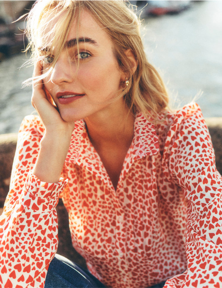 Woman wearing a Boden love heart shirt