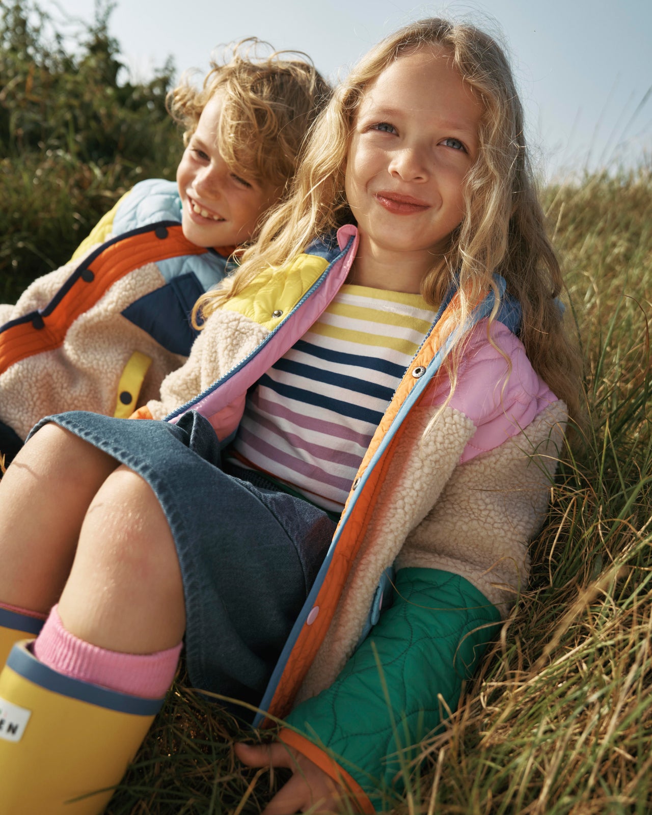 Children wearing Boden colourful jacket