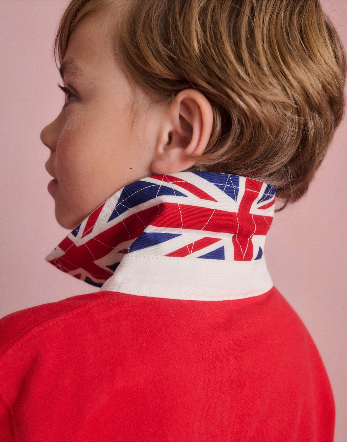 boy wearing shirt with collar lifted up