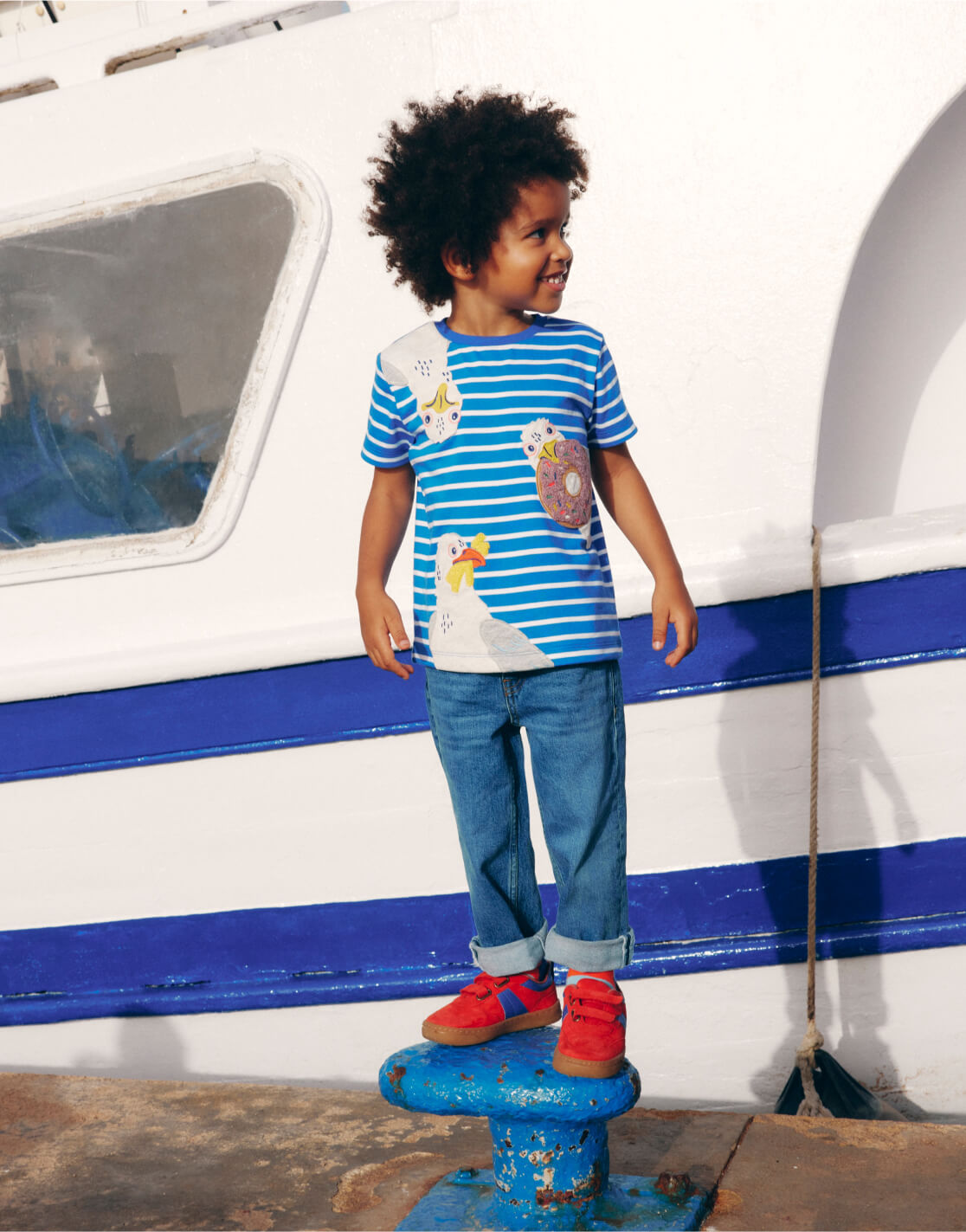 boy standing on wharf