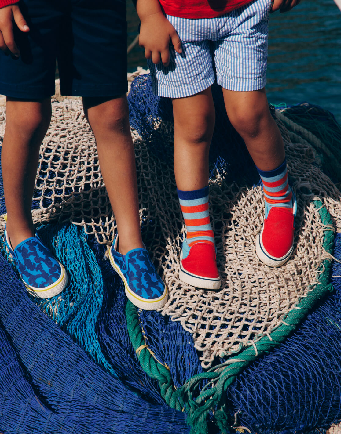 two boys standing on nets 