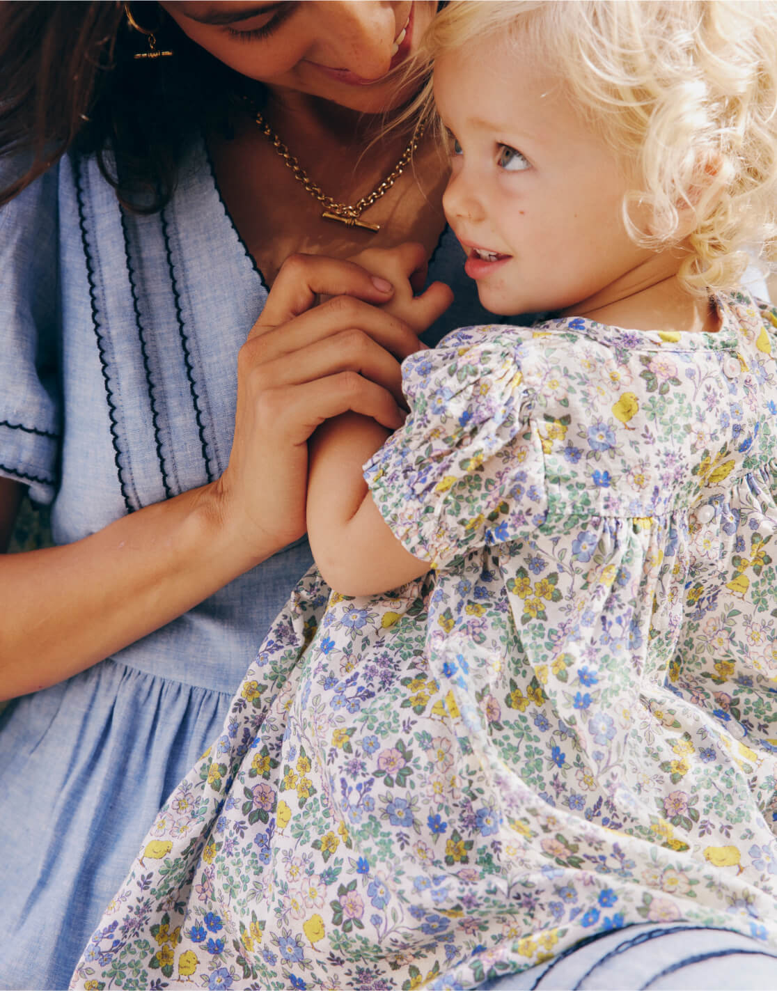 woman holding baby 