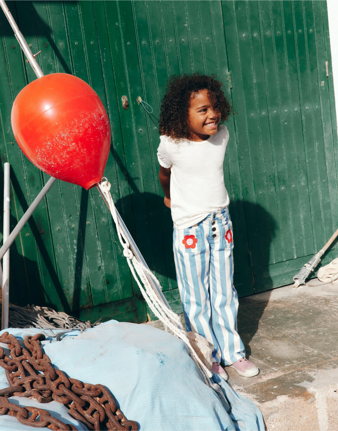 girl standing next to balloon 